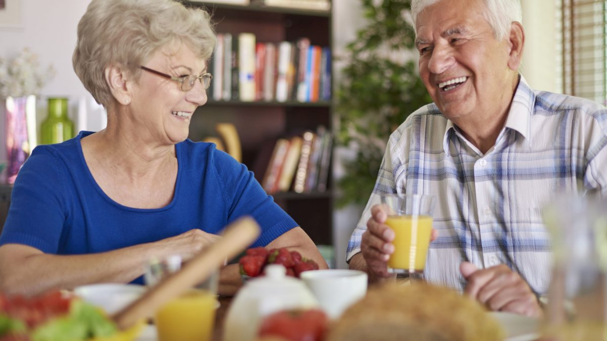 a senior couple enjoying a healthy breakfast together