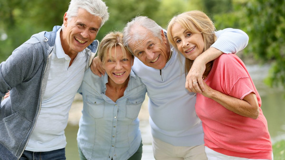 senior couples enjoying time in the woods and by a river