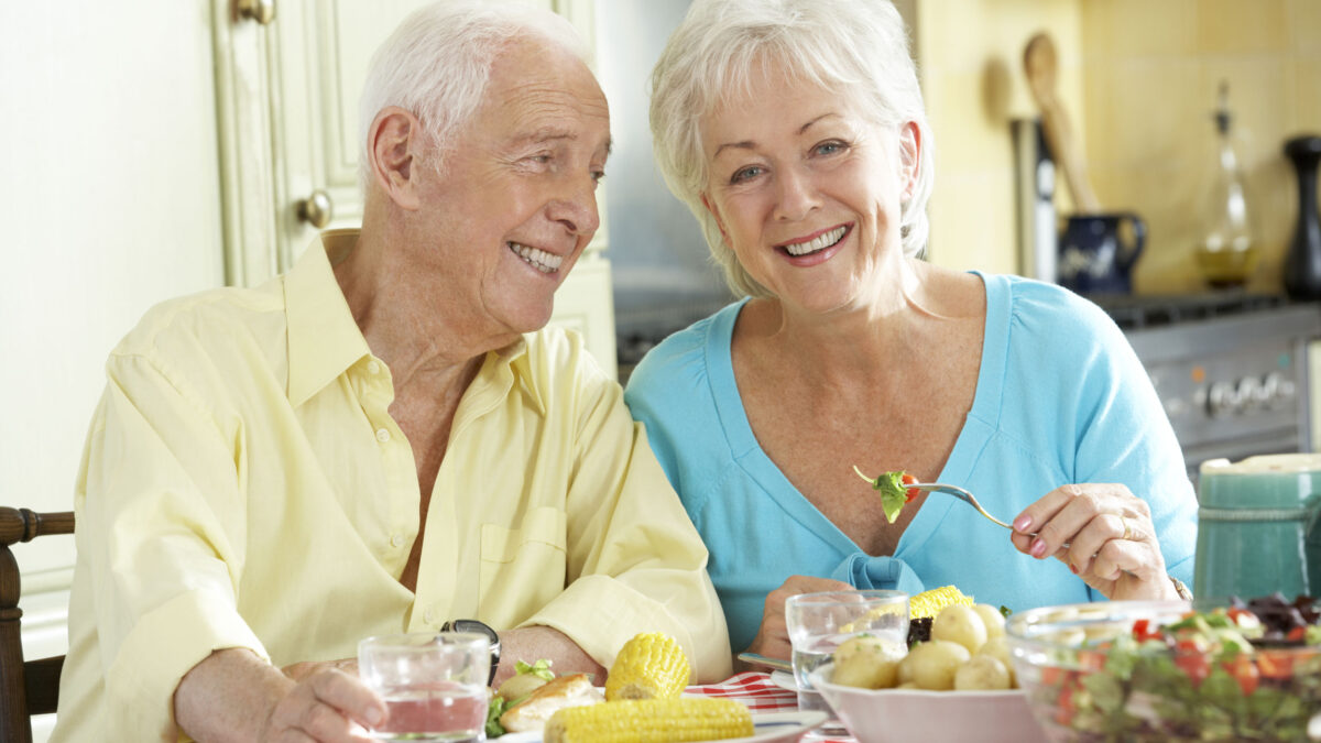 a senior couple eating a healthy meal together